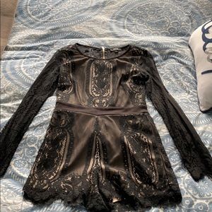 Long sleeve romper. Black lace with nude lining.